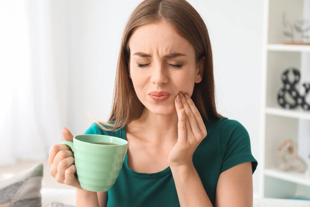 Lady Squinting Form Tooth Sensit