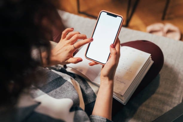 Anonymous Woman Using Her Mobile